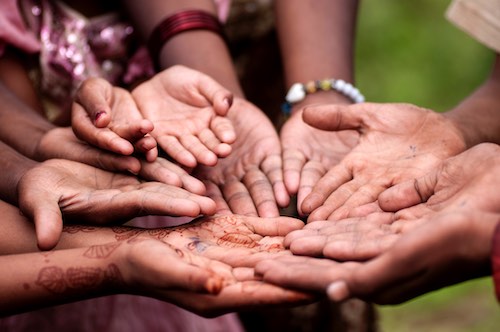 Close up of children putting their hands together. Close up of children putting their hands together.